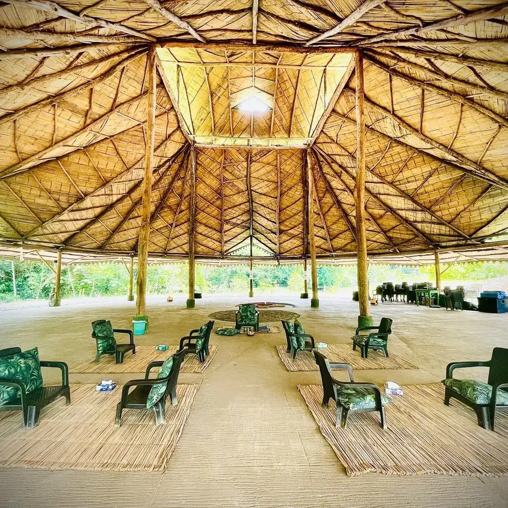 Covered gathering space, open to the forest